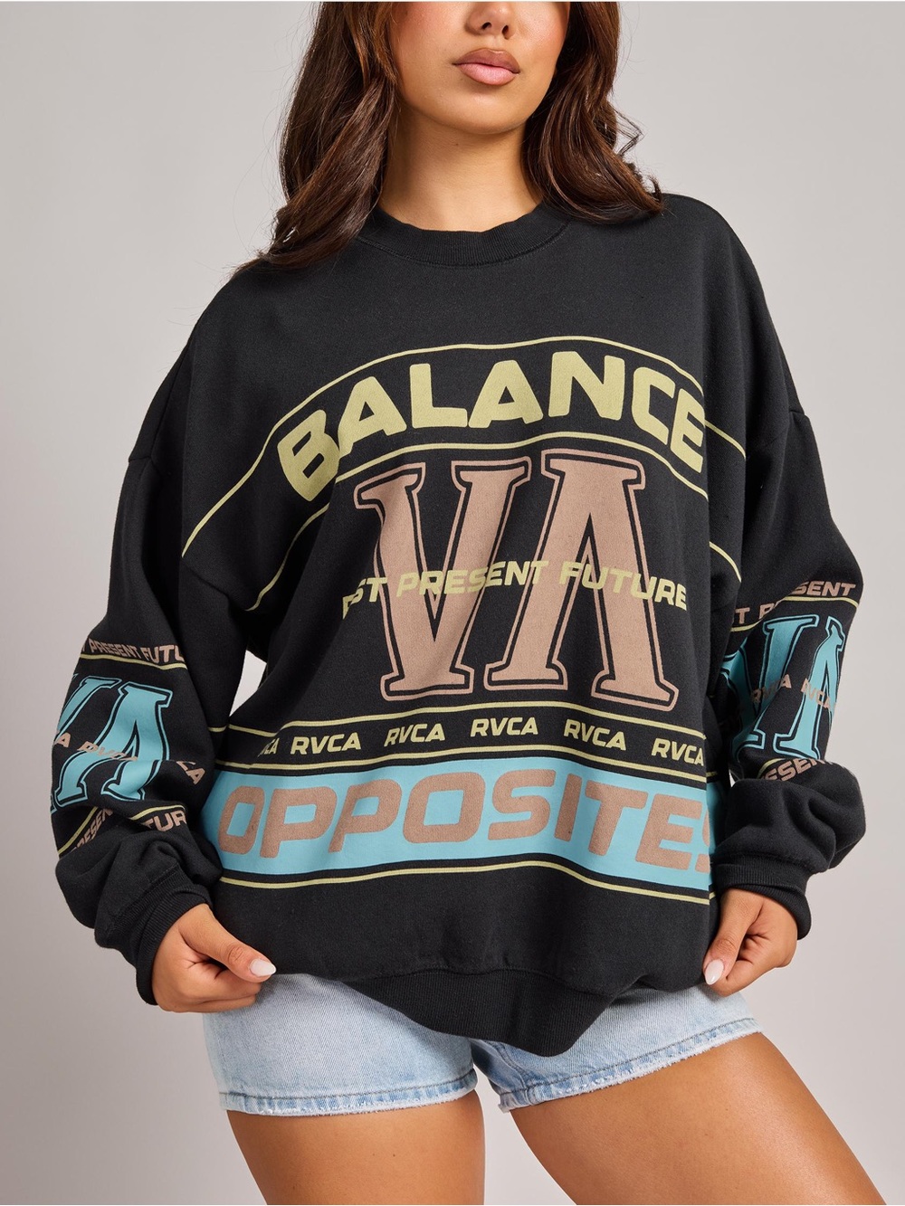 RVCA Black Crewneck Sweatshirt with Tan and Light Blue Graphics